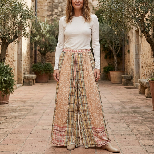 POL Clothing women's mocha floral plaid wide-leg pants styled with an ivory top in a courtyard - BellanBlue