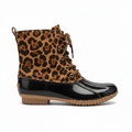 Leopard print boot with black rubber sole on a white background