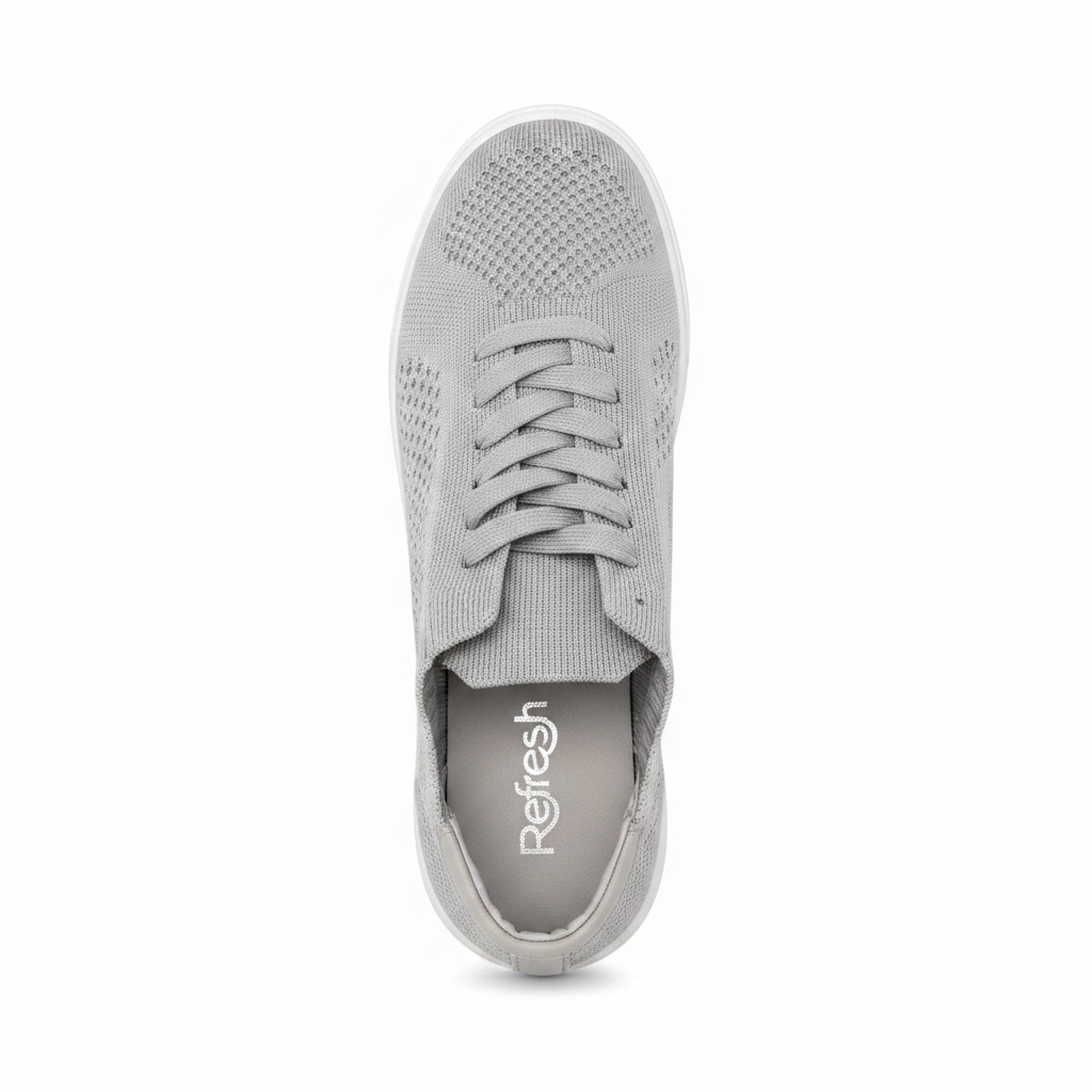 Women's light grey flyknit sneaker top-down view showing full knit upper and lace detail