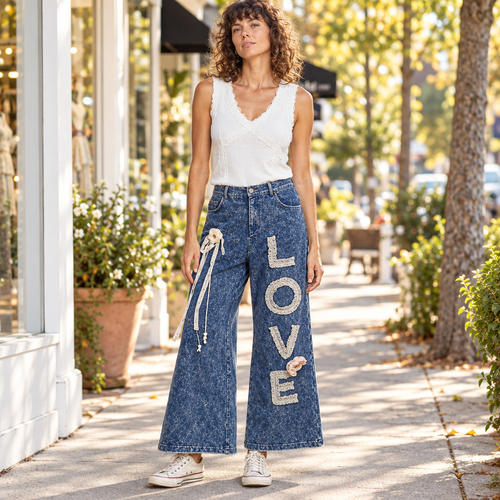 POL Clothing women's indigo LOVE appliqué wide-leg pants on boutique sidewalk - BellanBlue