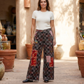 POL Clothing women's burgundy patchwork straight-leg pants styled in a courtyard - BellanBlue