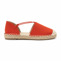 Blood orange suede-look espadrille flat with elastic cross-cord ankle strap and braided jute sole, side profile view, white background