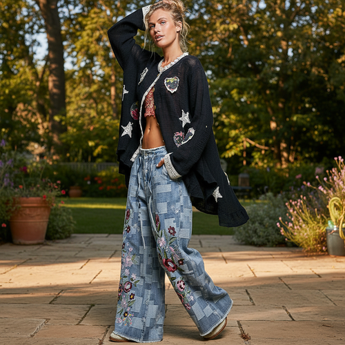 Women's black floral heart appliqué cotton cardigan with lace cuffs, garden brunch lifestyle
