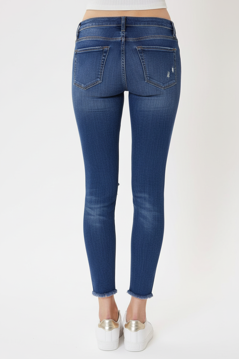 Mid-rise ankle jeans back view showing pockets and distressed details