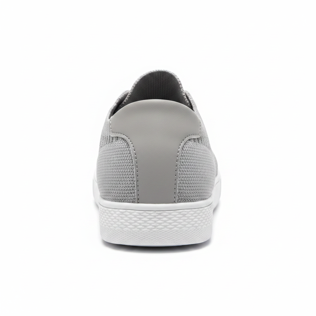 Women's light grey flyknit sneaker back heel view showing sock collar and textured white cupsole
