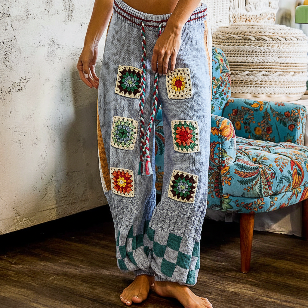 POL Clothing Blue Multi wide-leg knit pants, front close-up showing six granny square crochet patches and braided tassel tie

