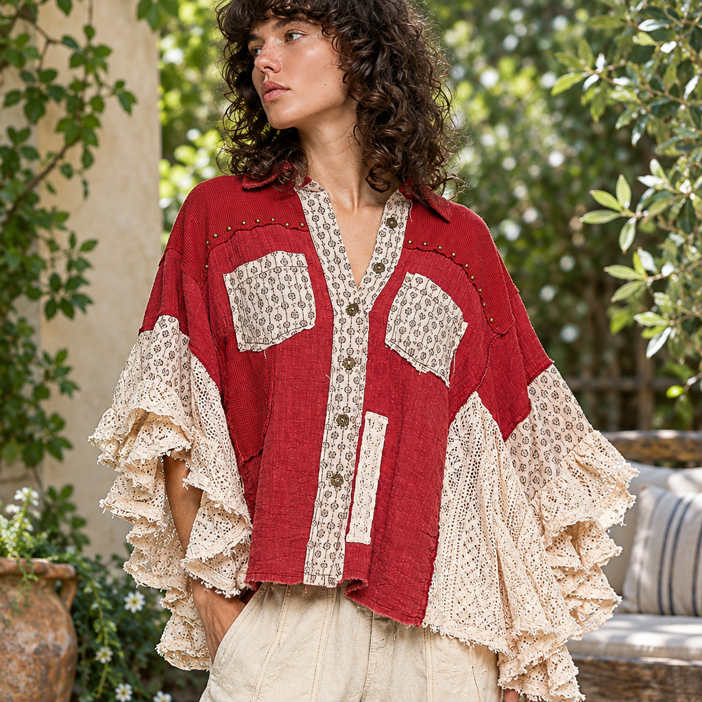 POL Clothing ruby red lace shirt close-up, cream crochet side panels and ruffled sleeves on patio