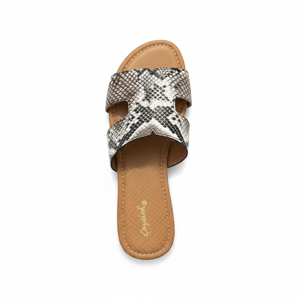 Snake print slide sandals top view showing cutout strap pattern detail
