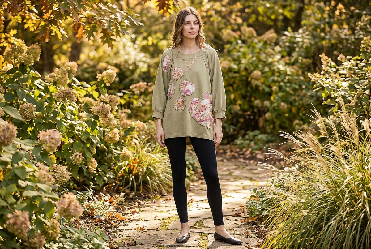 Blue Velvet sage heart patchwork sweatshirt relaxed oversized silhouette, full length on a garden path