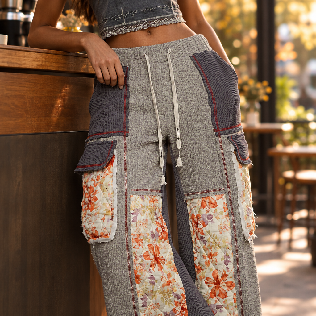 Close-up of POL Clothing grey waffle knit pants with coral floral cargo pocket and red topstitching