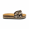 Women's toffee leopard canvas bow slide sandal with cork jute sole and tan footbed, side profile view, white background - BellanBlue