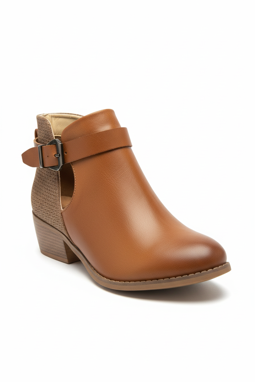Brown ankle boot with a strap on a white background