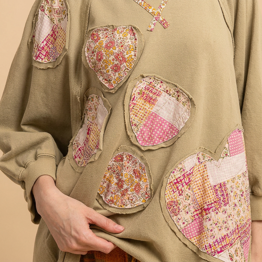 Blue Velvet sage heart patchwork sweatshirt close-up of floral heart appliques and raw-edge seams