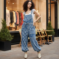 Denim wide leg pants styled with model standing near boutique storefront - BellanBlue