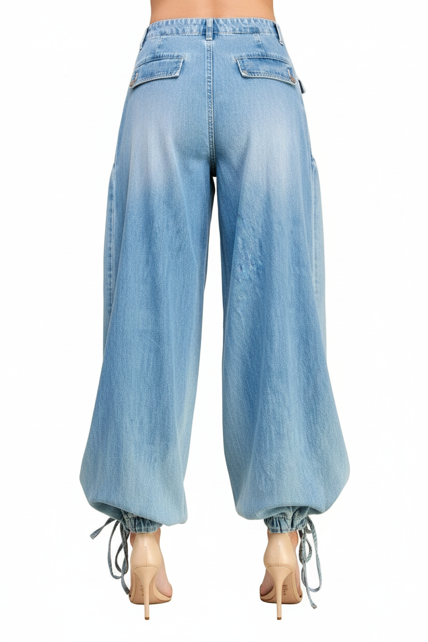 Light wash wide-leg denim cargo pants with ankle drawstring ties back view