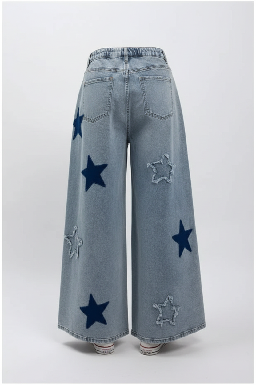 Star Patch Wide-Leg Distressed Jeans in light gray-blue wash - back view showing star patches and back pockets