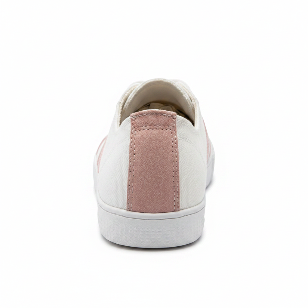 Women's white canvas sneaker back view blush pink suede heel counter stitching detail low top