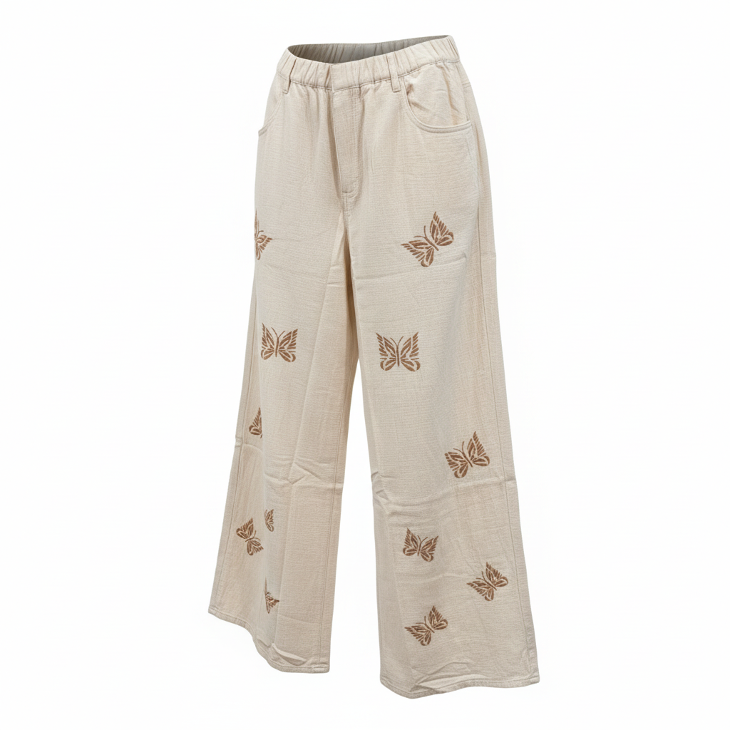 Women's ivory butterfly embroidered wide-leg pants front view, textured woven fabric, elastic waist, relaxed fit