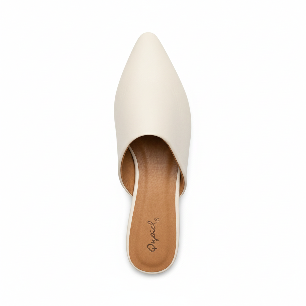 White pointed-toe mule - top view showing cushioned tan insole and interior
