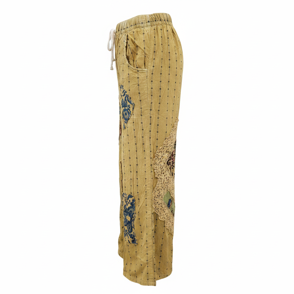 Women's mustard yellow palazzo pant side profile, artisan patchwork inserts, side pocket, crinkled cotton, relaxed wide-leg fit