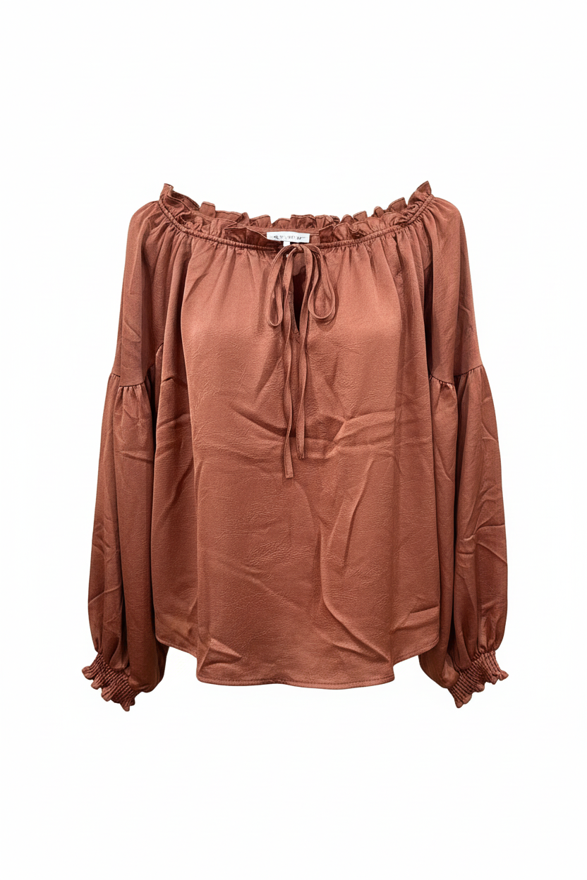 Terracotta ruffle off-shoulder blouse front view with tie-front detail and tiered sleeves