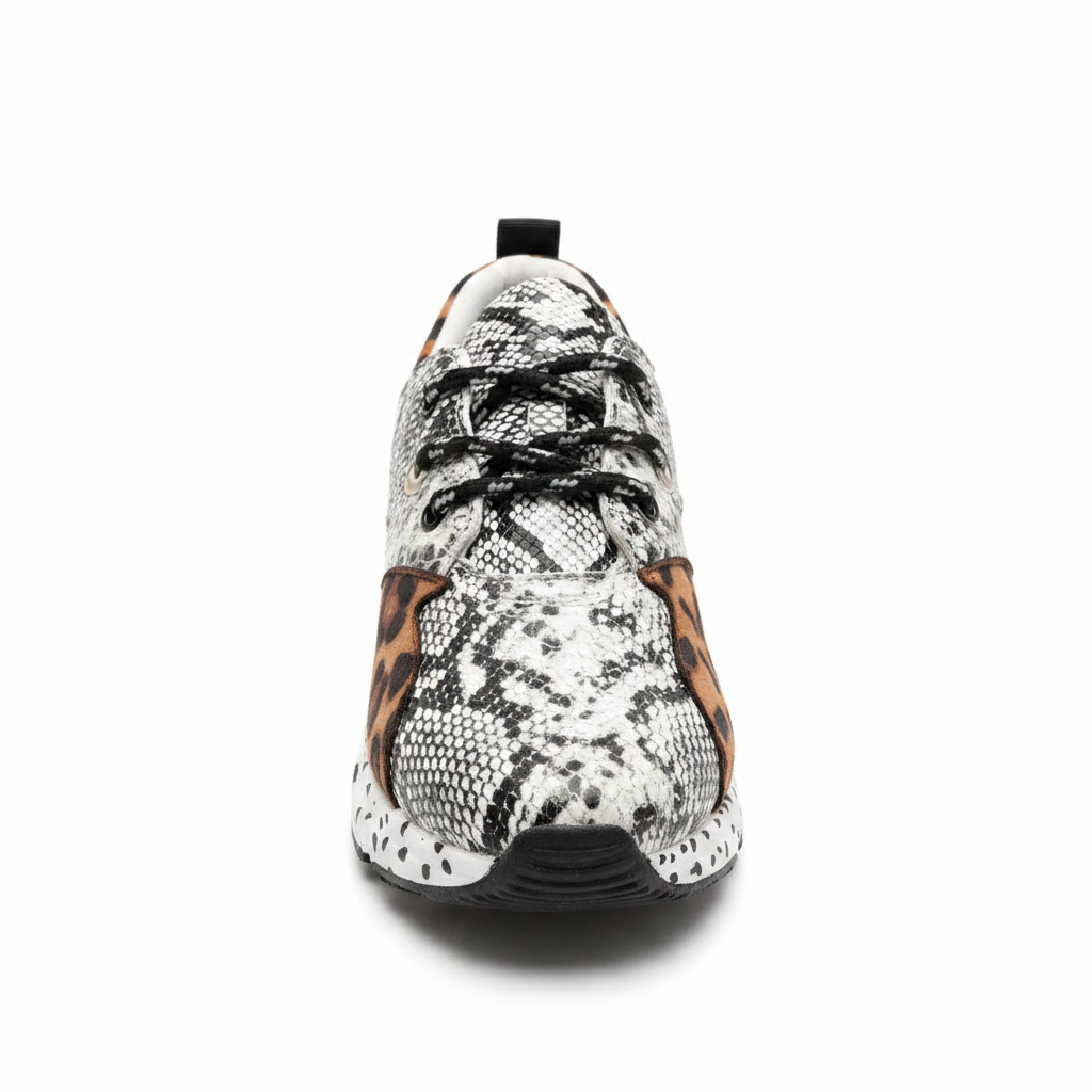 Black and white snakeskin platform sneaker with leopard accent panels and silver eyelets, front view, white background