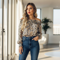 Woman wearing snake print off-shoulder top styled with high-waisted jeans