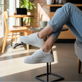 White platform sneakers with leopard print detail styled at trendy coffee shop - lifestyle photo
