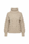 Latte beige turtleneck sweater with pom-pom bobbles, professional ghost mannequin front view on white background