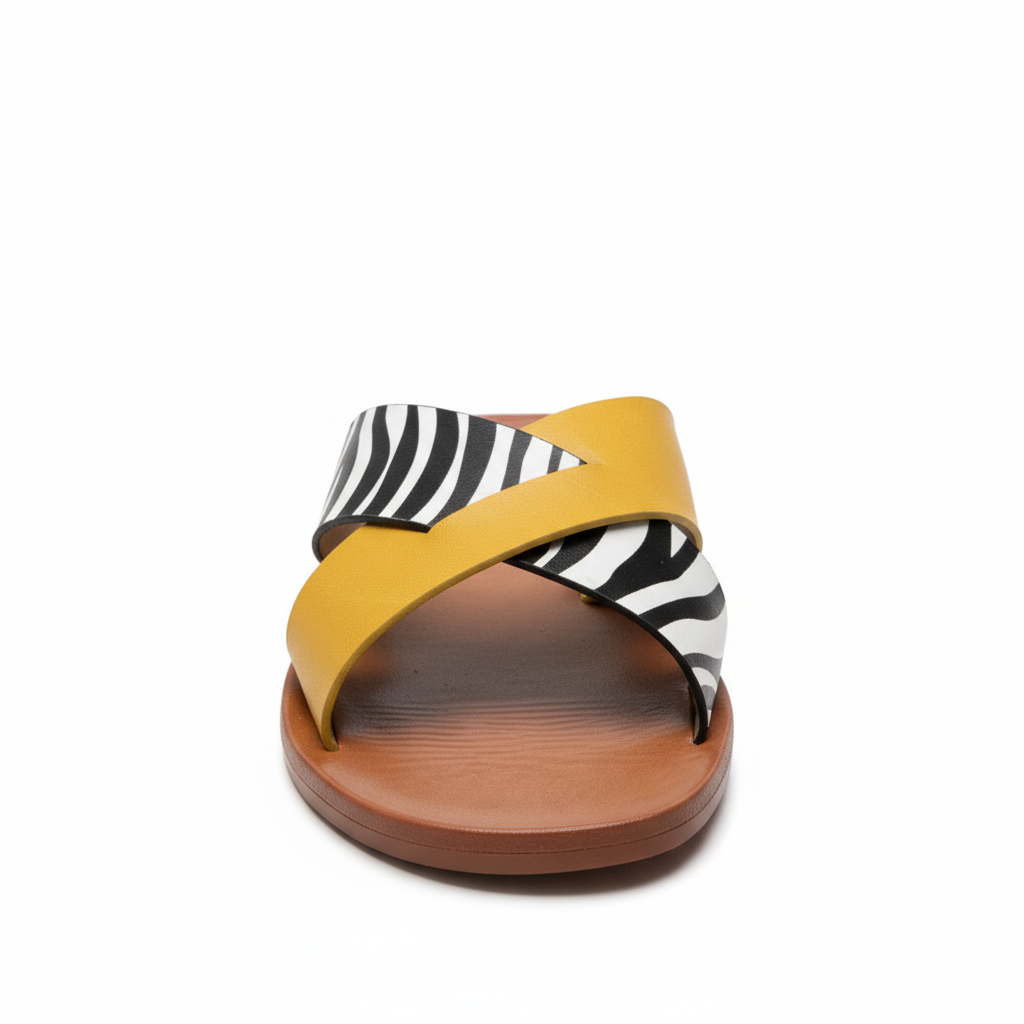 Mustard yellow and zebra print cross-strap flat slide sandal, front view, white background