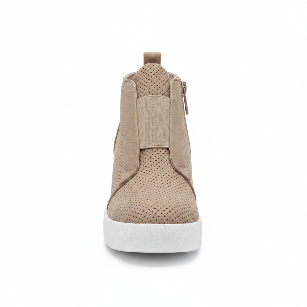 A single beige ankle sneaker with a perforated upper, elastic side panel, and a thick white platform sole, shown from a front-facing perspective on a white background.