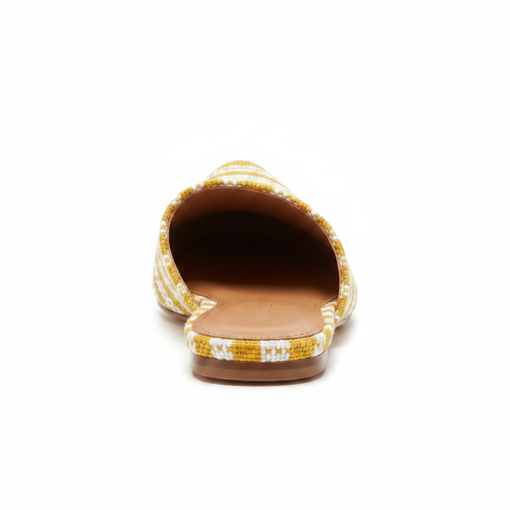 Back view of women's backless woven mule showing open heel and yellow stripe textile upper on white background