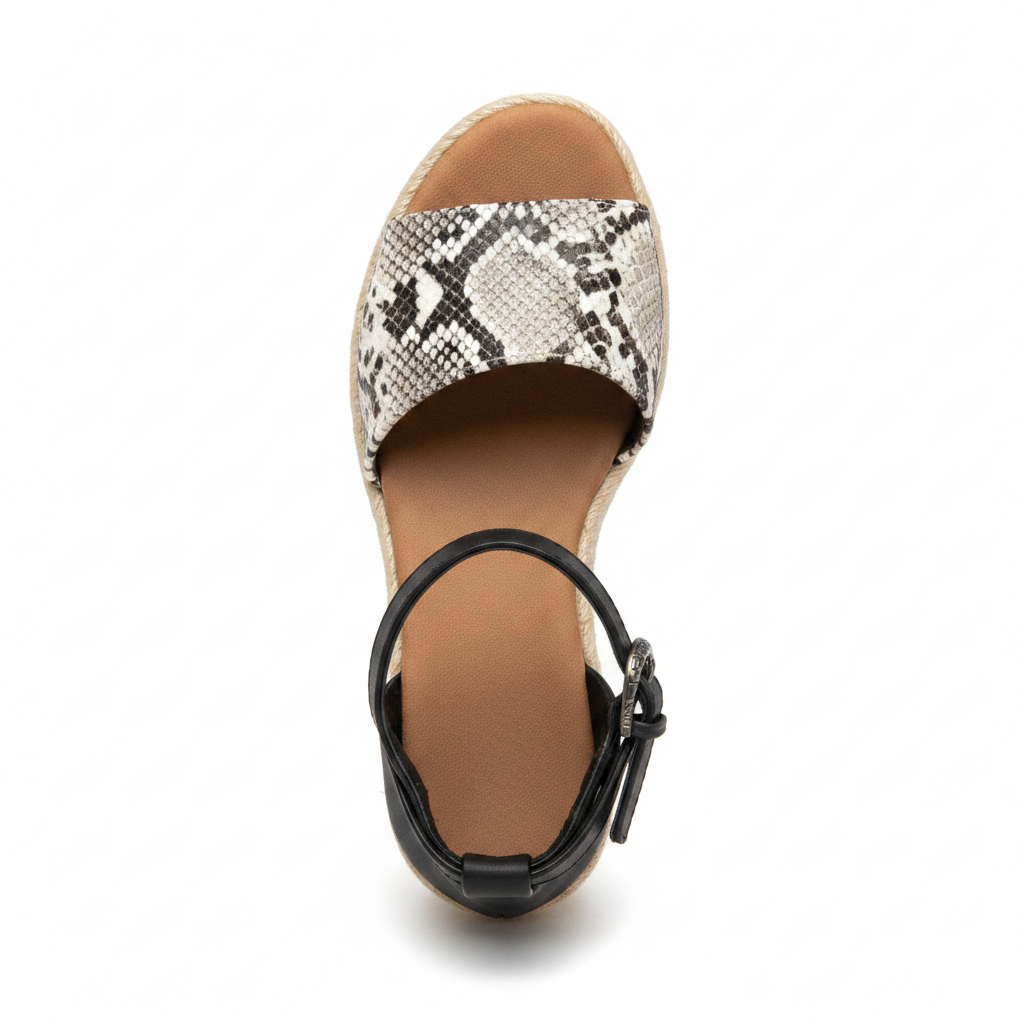 Women's snake print espadrille wedge sandal top-down view showing snake print upper and ornate western buckle detail