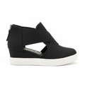 Black slip-on sneakers with crisscross straps - side profile view showing zipper closure