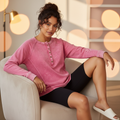 Zenana Women's Fuchsia Washed French Terry Henley Raglan Top styled with black biker shorts for a casual athleisure look