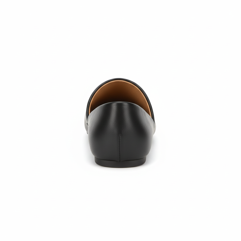 Women's black pointed-toe mule, back heel view showing open back slip-on silhouette and tan footbed, white background
