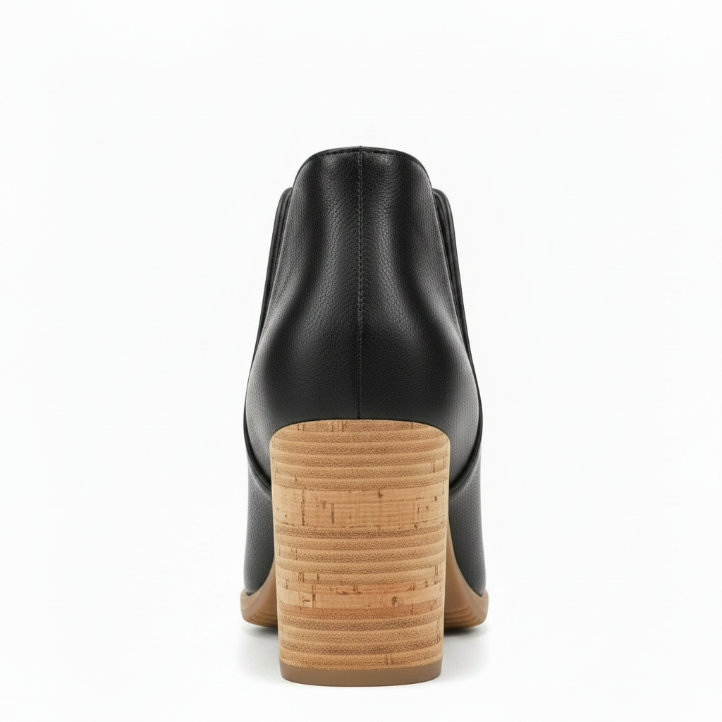 Back view of women's black faux leather peep toe bootie showing chunky stacked cork block heel and clean top edge