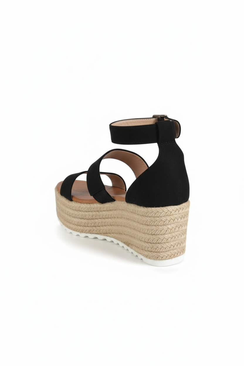 Black wedge sandal with espadrille sole on a white background