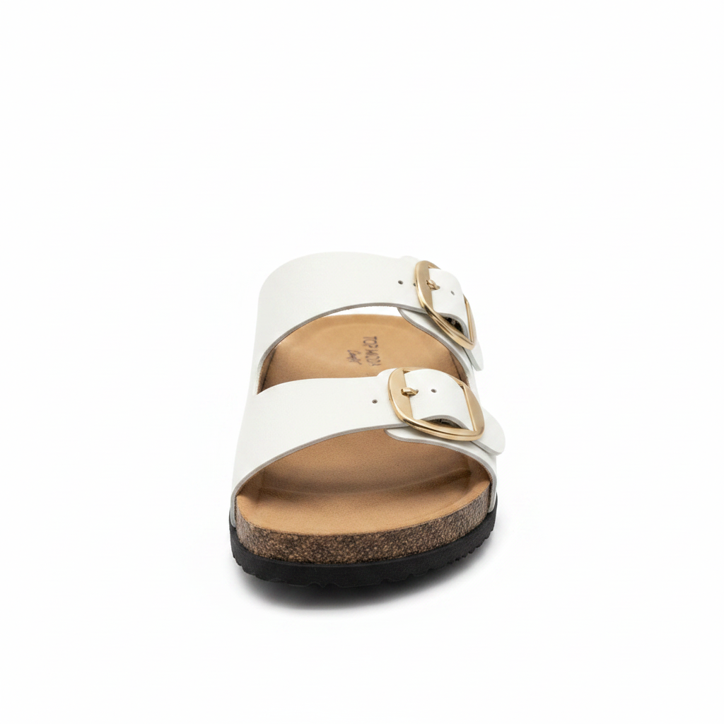 Women's white faux leather double buckle slide sandal with gold hardware and cork midsole, front view, white background