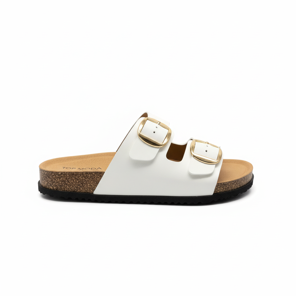 Women's white double-strap slide sandal with oversized gold square buckles and cork footbed, right foot side profile view, white background