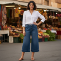 Women's medium blue wide-leg denim culottes styled with linen shirt outdoor market - BellanBlue