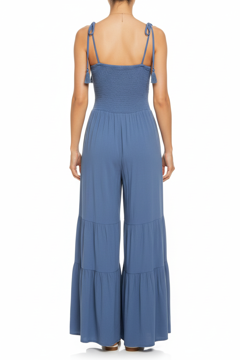 Smocked ruffle jumpsuit - back view showing tie shoulder straps and tiered ruffle pants