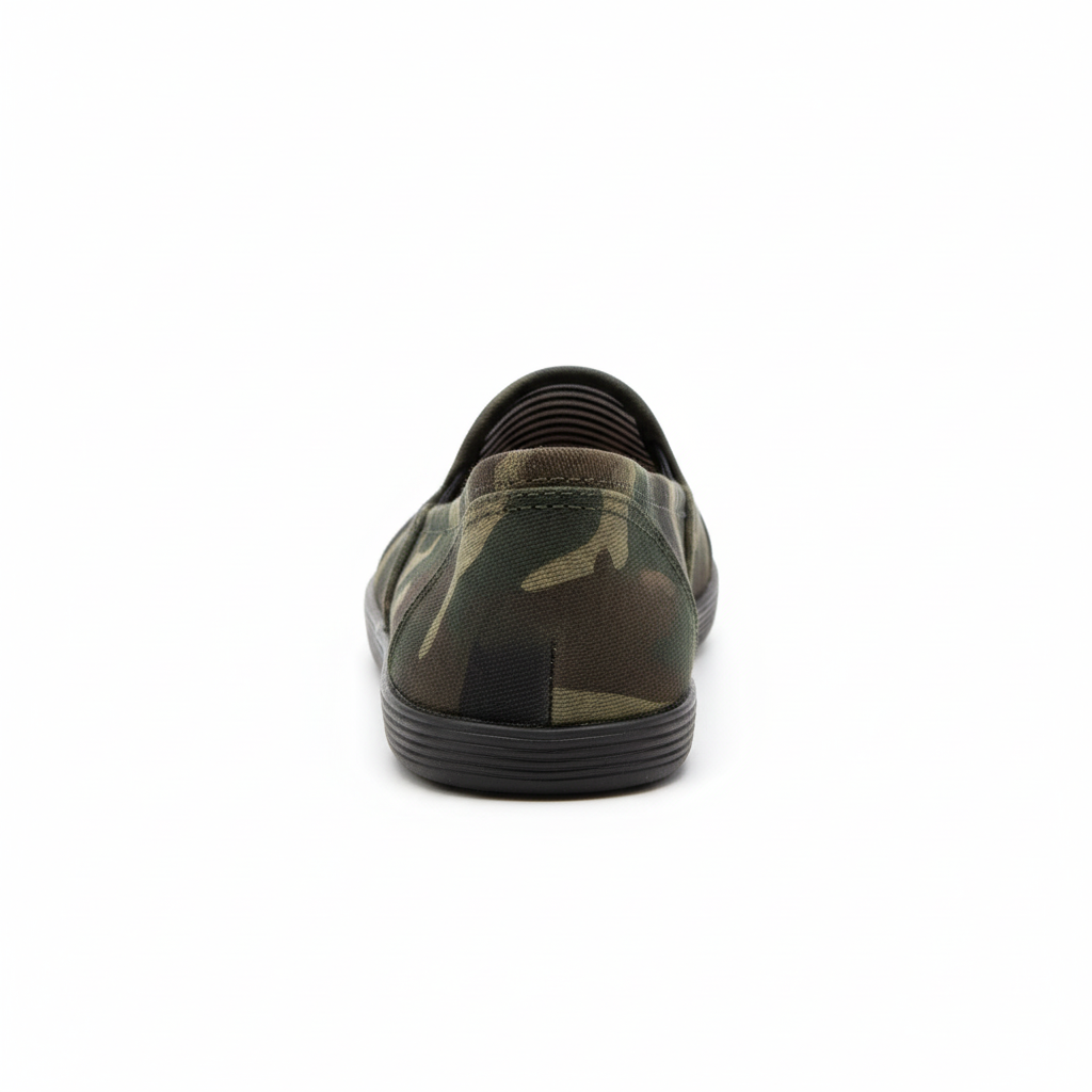 Women's camouflage canvas slip-on flat shoe, back heel view showing elastic gore and striped lining, white background