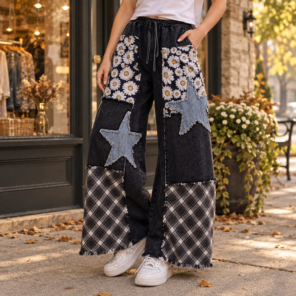 Sage + Fig denim patchwork pants detail showing star appliqués and frayed plaid hems