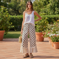 BiBi women's cream black polka dot wide leg pants with eyelet lace hem, garden patio lifestyle styling - BellanBlue