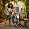 Women's black multi patchwork overalls with ruffled elastic straps styled with white tank and sandals for a relaxed brunch outfit