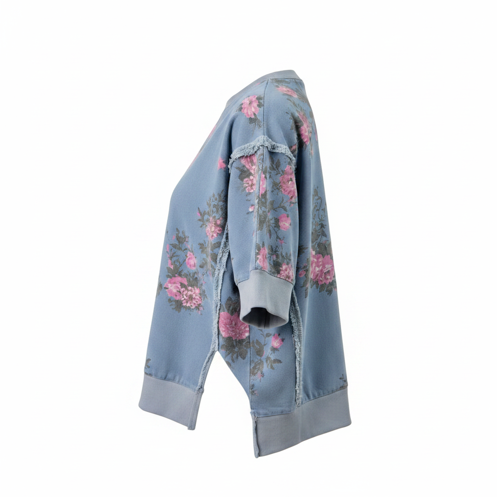 Women's blue floral sweatshirt side view, ghost mannequin, boxy silhouette, raw seam trim, ribbed cuff, side slit