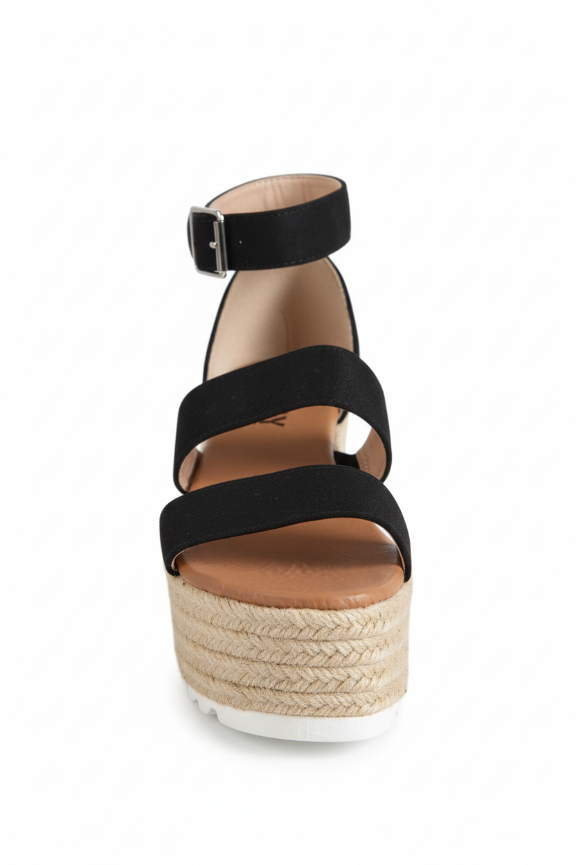Black wedge sandal with espadrille sole on a white background