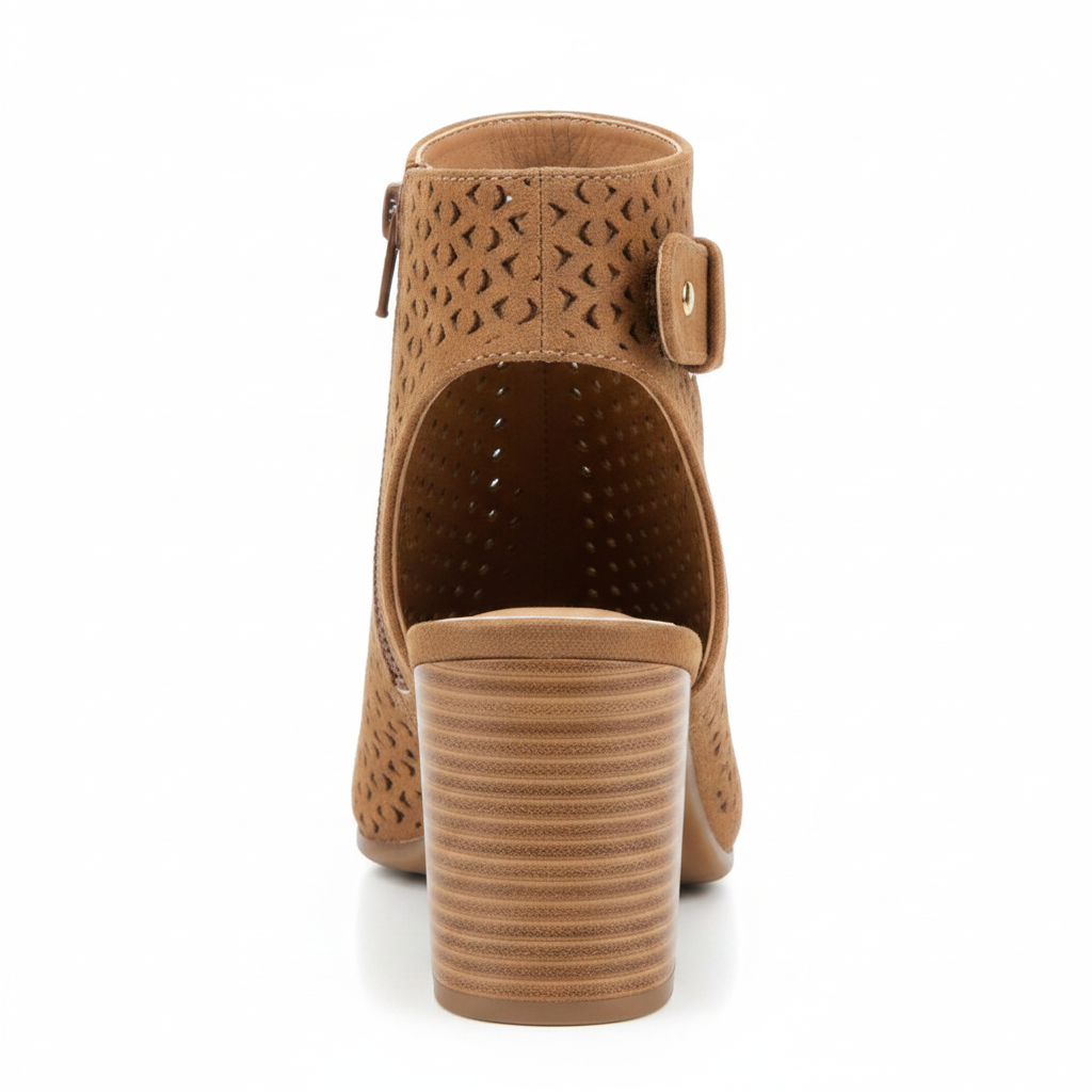Back view of tan perforated slingback bootie showing open heel cutout, ankle strap, and gold stud rivet detail