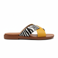 Mustard yellow and zebra print cross-strap flat slide sandal, side profile view, white background